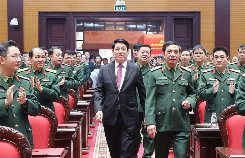 State President Luong Cuong (in black suite) attends the national political-military conference in Ha Noi on December 17. (Photo: VNA)