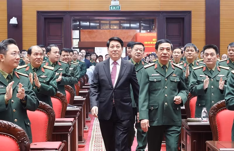 State President Luong Cuong (in black suite) attends the national political-military conference in Ha Noi on December 17. (Photo: VNA)