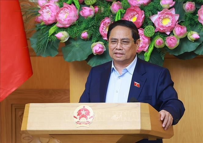 Prime Minister Pham Minh Chinh speaks at the meeting. (Photo: VNA)