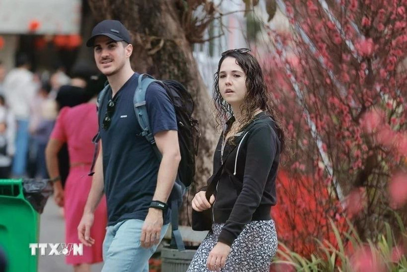 Foreign tourists visit Ha Noi on the Lunar New Year. (Photo: VNA)