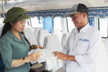 Tourists exchange single-use plastic bags for safe biodegradable ones at the passenger port before travelling to Co To island.