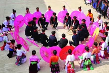 Students from Can Chu Phin Village (former Ha Giang Province) take part in a flag-raising activity themed “Bringing traditional culture into schools.”