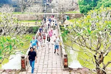 International tourists visit a heritage site in Hue.
