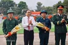 National Assembly Chairman Tran Thanh Man (second from left) at the military handover and enlistment ceremony. (Photo: VNA)