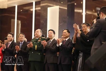 From left: Minister of Science and Technology Nguyen Manh Hung (fourth), Deputy Prime Minister Bui Thanh Son (fifth), Japanese Ambassador Ito Naoki (sixth), and delegates at the reception in Ha Noi on March 3 to celebrate the 66th birthday of His Majesty Emperor Naruhito. (Photo: VNA)