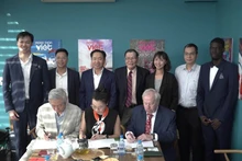 Representatives from both sides sign a memorandum of understanding on cooperation.