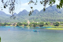Boats carry visitors on a tour of Phong Nha Cave.