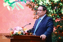 Prime Minister Pham Minh Chinh addresses the reception for outstanding intellectuals, artists, journalists, athletes, coaches and representatives of cultural and tourism enterprises on February 23. (Photo: VNA)