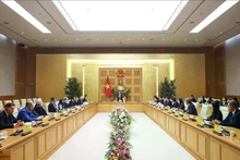 Prime Minister Pham Minh Chinh holds a meeting with a delegation of Swiss and European businesses led by Dr Philipp Rösler, President of the Swiss–Viet Economic Forum, on February 3, 2026. (Photo: VNA)