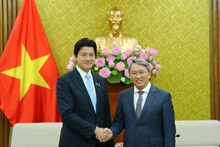 Vietnamese Minister of Justice Nguyen Hai Ninh and the Japanese Vice Minister of Justice Mitani Hidehiro at the meeting.