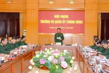 General Phan Van Giang, Politburo member, Deputy Secretary of the Central Military Commission and Minister of National Defence, delivers instructions at the meeting.