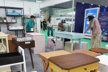 Visitors explore export wood and furniture products at a trade fair held in Ho Chi Minh City. (Photo: nhandan.vn)