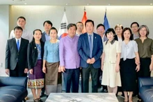 Officials of the Vietnamese Embassy and the Lao Embassy in the RoK pose for a commemorative photo. (Photo: Vietnamese Embassy in the RoK)