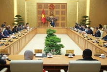 The meeting between Deputy Prime Minister Tran Hong Ha and the delegation of international agriculture ministers and senior officials on July 15. (Photo: VNA)