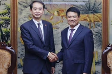 Supreme People’s Procuratorate Chief Prosecutor Nguyen Huy Tien and He Wei, Ambassador Extraordinary and Plenipotentiary of the People’s Republic of China to Viet Nam.