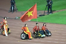 The Vietnamese Paralympic team parades at the closing ceremony of the Games.