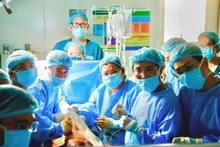 Doctors and nurses in the fetal heart intervention for a Singaporean pregnant woman.