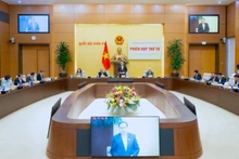 Politburo member and National Assembly Chairman Tran Thanh Man, Chairman of the National Election Council, presides over the fourth session of the National Election Council on December 15. (Source: quochoi.vn)