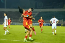 Vietnamese players celebrate a goal at the match against Myanmar on June 9 (Photo: VNA)