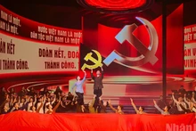 A performance from the political and artistic performance programme titled “Forever Faithful to the Party”. (Photo: BAO LONG)