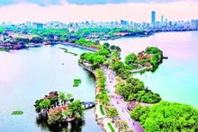 West Lake and Truc Bach Lake hold profound historical and cultural value and are an important part of the spiritual life of Ha Noi’s people. (Photo: Tue Nghi)