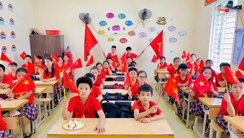 Classrooms, even in kindergartens, are filled with red flags bearing yellow stars. Classrooms, even in kindergartens, are filled with red flags bearing yellow stars.