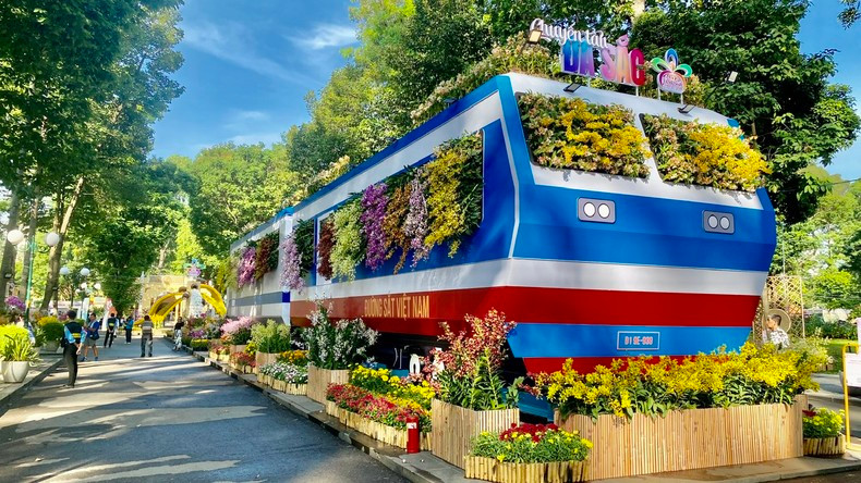 With the theme of “The Multicoloured Train”, the two historic Reunification trains are designed to be filled with orchids. With the theme of “The Multicoloured Train”, the two historic Reunification trains are designed to be filled with orchids.