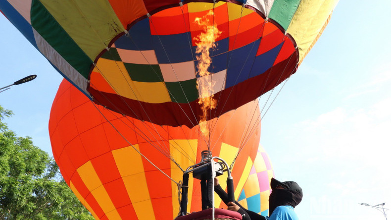 Technicians preparing balloons for flight.