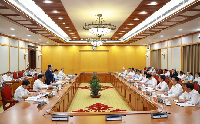 At the working session. Photo: VNA At the working session. Photo: VNA