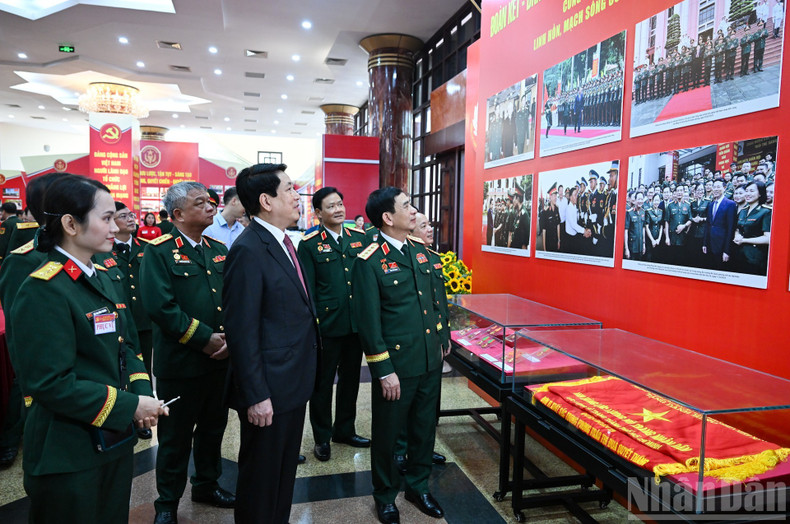 President Luong Cuong and other delegates visit the exhibition area within the framework of the congress. military4.jpg
