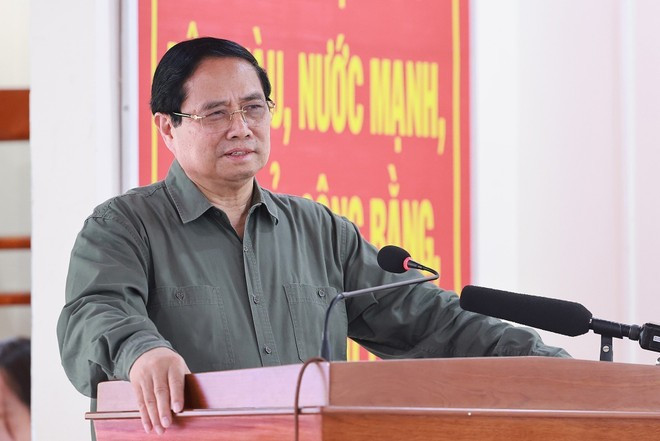Prime Minister Pham Minh Chinh speaks at the national great unity festival in Thang Kien hamlet, De Gi commune in Gia Lai province on November 13, 2025 (Photo: VNA)