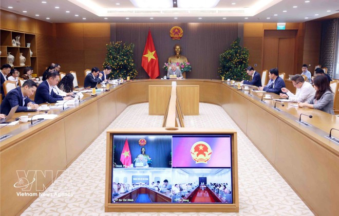 Permanent Deputy Prime Minister Nguyen Hoa Binh speaks at the meeting to review the development strategy and operational framework for the international financial centre. (Photo: VNA)
