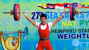 Weightlifter Thach Kim Tuan wins the men's 56kg gold medal and breaks two SEA Games records