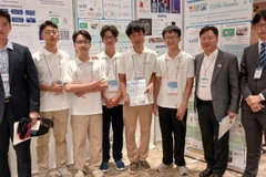 Tran Thuan Hieu (third from the right) and the Viet Nam team receive the Silver Medal at the World Invention Creativity Olympic (WICO) 2025 in the Republic of Korea. (Photo: nhandan.vn)