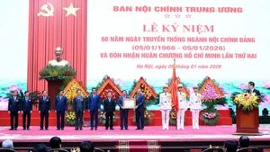Party General Secretary To Lam presents the Ho Chi Minh Order for the second time to the Party Central Committee’s Commission for Internal Affairs. (Photo: DANG KHOA)