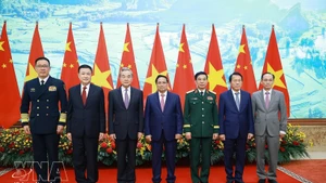 Prime Minister Pham Minh Chinh (centre) and the Vietnamese and Chinese ministers of foreign affairs, national defence and public security at the meeting in Ha Noi on March 16. (Photo: VNA)