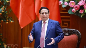 Prime Minister Pham Minh Chinh speaks at the meeting of permanent Government members in Ha Noi on March 16. (Photo: VNA)