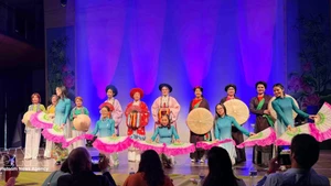 An ao dai fashion show at the grand music programme on March 8, presented by the Vietnamese ao dai heritage club in Belgium in coordination with the UGVB Women’s Association. (Photo: VNA)