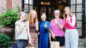 International visitors engaging with the cultural experiences at Sinh Duoc.