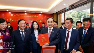 NA Chairman Tran Thanh Man (centre) at the book launch in Ha Noi on February 24. (Photo: VNA)
