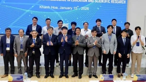 Delegates pose for a commemorative photo at the conference.