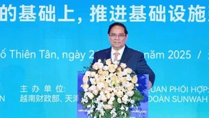 Prime Minister Pham Minh Chinh addresses the Viet Nam-China business forum. (Photo: VNA)