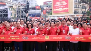 People join the 2026 Olympic Run Day for public health, national security in Ha Noi. (Photo: VNA)