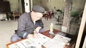Folk artisan Ly Dai Thong has been researching and documenting the customs and practices of the Dao community.
