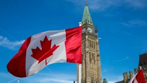 The Canadian flag flies over Parliament Hill in Ottawa. (Photo: Government of Canada)