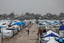 Photo taken on Dec. 11, 2025 shows shelters of displaced Palestinians in the Zeitoun neighborhood, southeast of Gaza City. Heavy winter rains and high winds are pounding flimsy temporary shelters of tents and tarps in the Gaza Strip, putting more vulnerable people at risk, UN humanitarians have said. (Photo: Xinhua)