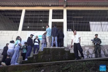 Voters line up as they wait to cast their ballots at a polling station during the general elections in Tegucigalpa, capital of Honduras, Nov. 30, 2025. Honduras on Sunday launched nationwide general elections to choose a new president and members of Congress. (Photo: Xinhua)