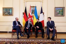 British Prime Minister Keir Starmer (2nd L), Ukrainian President Volodymyr Zelensky (2nd R), French President Emmanuel Macron (1st R) and German Chancellor Friedrich Merz make remarks as they meet in 10 Downing Street in London, Britain, Dec. 8, 2025. (Lauren Hurley/No. 10 Downing Street/Handout via Xinhua)