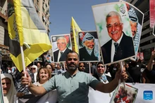 Palestinians celebrate with portraits of Palestinian leaders Yasser Arafat and Mahmoud Abbas during a rally in West Bank city of Nablus, on Sept. 23, 2025. Rallies were held in several cities across the West Bank on Tuesday to celebrate the Western recognition of the State of Palestine and to show solidarity with the people of the Gaza Strip. (Photo: Xinhua) 