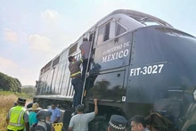 This photo taken with a mobile phone on Dec. 28, 2025 shows the site of a train derailment accident in Municipality of Asuncion Ixtaltepec, State of Oaxaca, Mexico. A passenger train carrying 241 passengers and nine crew members derailed on a bridge near Nizanda in southern Mexico on Sunday, leaving at least 13 people dead and 98 others injured, the Secretariat of the Navy said on social media. (Str/Xinhua)